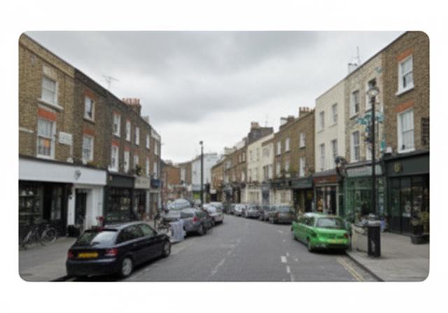 Street view around Westcott Crescent in London with low-rise buildings and parked cars